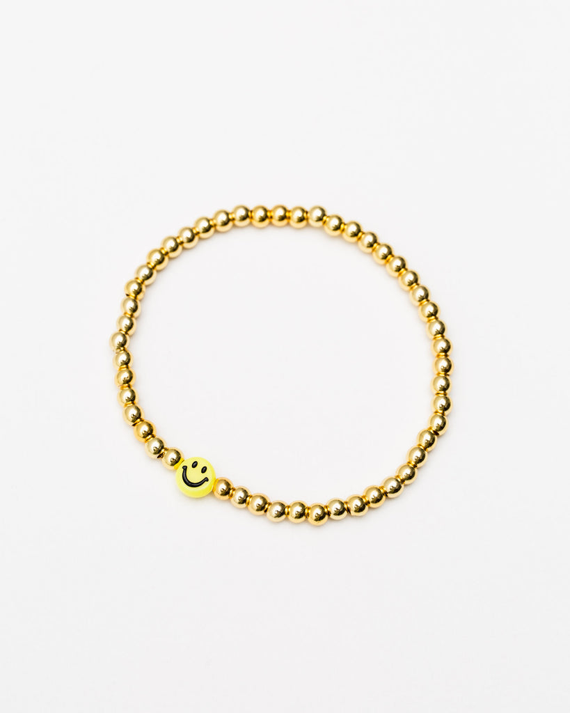 Goldfarbenes Perlenarmband mit grinsendem Smiley - Broke + Schön#farbe_gold-colored